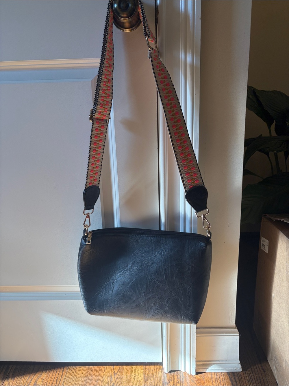 Black Leather Crossbody Bag with Patterned Strap